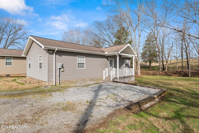 518 Church St, Vonore, TN 37885 - view of front of house with a porch, a front yard, gravel driveway, and a shingled roof