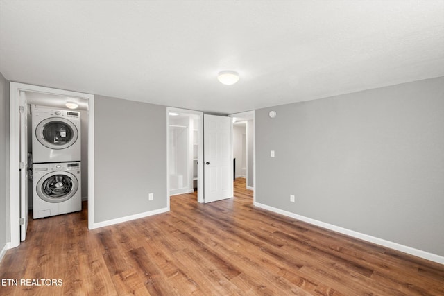 518 Church St, Vonore, TN 37885 - washroom with stacked washer / dryer, baseboards, and wood finished floors