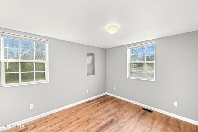 518 Church St, Vonore, TN 37885 - unfurnished room with electric panel, healthy amount of natural light, baseboards, and wood finished floors