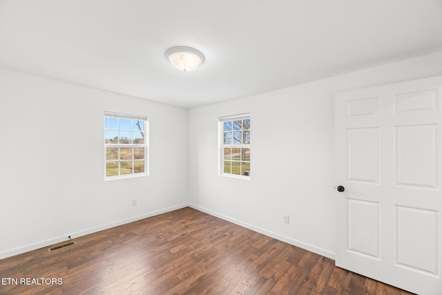 522 Church St, Vonore, TN 37885 - unfurnished room with plenty of natural light, dark wood-type flooring, and baseboards