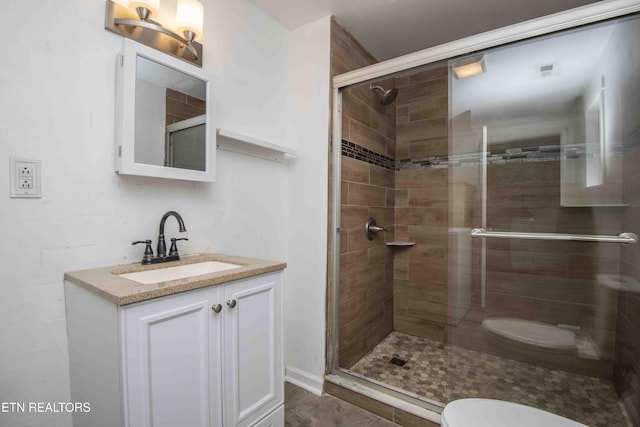 2918 Johnston St, Knoxville, TN 37921 - bathroom featuring toilet, a stall shower, and vanity