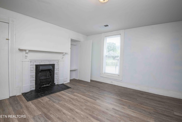 2918 Johnston St, Knoxville, TN 37921 - unfurnished living room featuring wood finished floors and baseboards