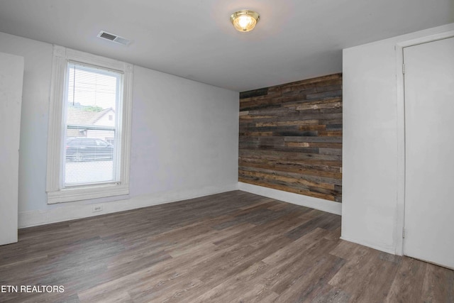 2918 Johnston St, Knoxville, TN 37921 - spare room with wooden walls, wood finished floors, and baseboards