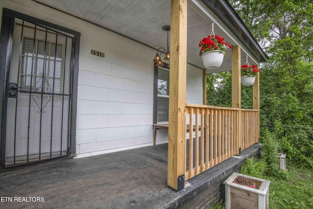 2918 Johnston St, Knoxville, TN 37921 - property entrance with covered porch and concrete block siding
