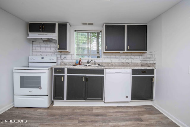 2918 Johnston St, Knoxville, TN 37921 - kitchen with white appliances, under cabinet range hood, a sink, and tasteful backsplash