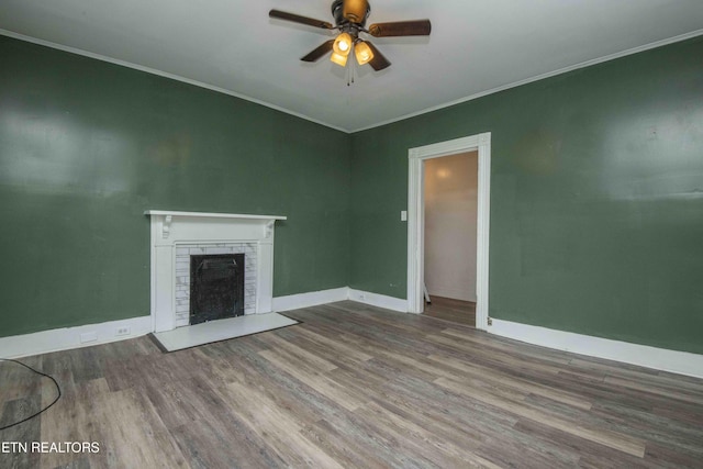 2918 Johnston St, Knoxville, TN 37921 - unfurnished living room featuring wood finished floors, ornamental molding, ceiling fan, a fireplace, and baseboards