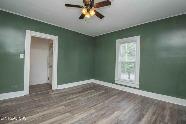 2918 Johnston St, Knoxville, TN 37921 - unfurnished room with crown molding, wood finished floors, ceiling fan, and baseboards