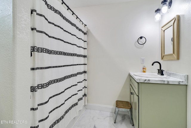 98 Paso Fino Trl, Jamestown, TN 38556 - bathroom with marble look tiles, vanity, baseboards, and curtained shower