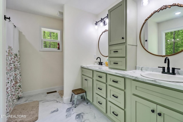 98 Paso Fino Trl, Jamestown, TN 38556 - bathroom featuring double vanity, marble finish flooring, and baseboards