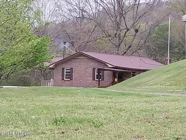 3381 Upper Caney Valley Rd, Tazewell, TN 37879 - view of home's exterior with a lawn