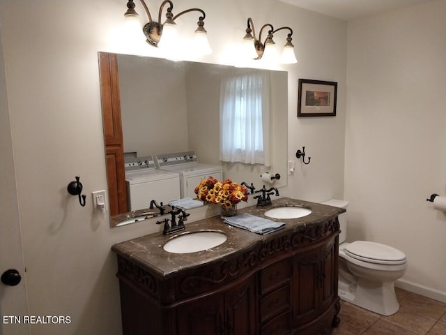 3381 Upper Caney Valley Rd, Tazewell, TN 37879 - bathroom featuring independent washer and dryer, toilet, double vanity, and tile patterned flooring