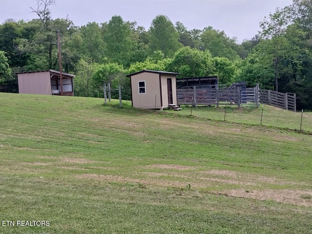 3381 Upper Caney Valley Rd, Tazewell, TN 37879 - view of yard featuring an outbuilding, an outdoor structure, and a view of trees