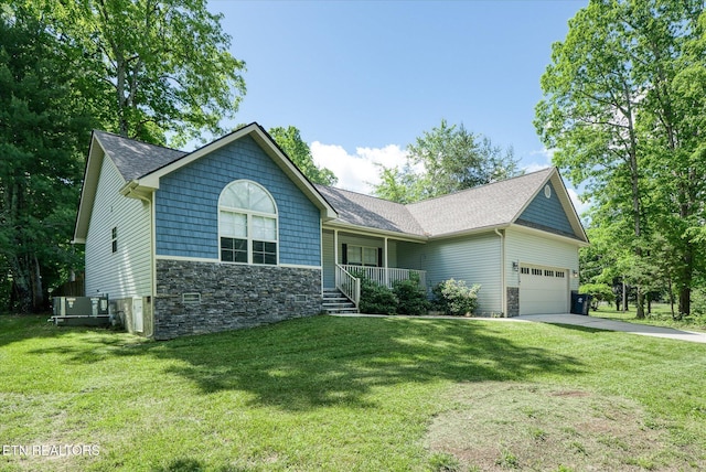 2689 Spruce Loop, Crossville, TN 38555 - ranch-style home featuring a porch, stone siding, an attached garage, driveway, and roof with shingles