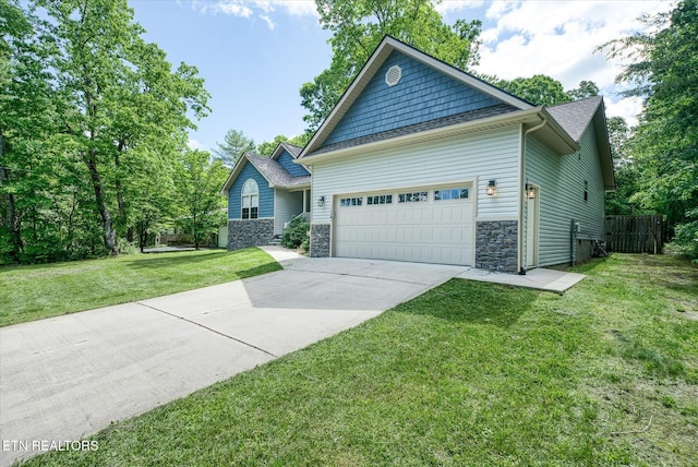 2689 Spruce Loop, Crossville, TN 38555 - craftsman house with a garage, driveway, and stone siding