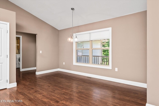 2689 Spruce Loop, Crossville, TN 38555 - empty room with washer / dryer, dark wood-type flooring, vaulted ceiling, and baseboards