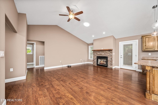 2689 Spruce Loop, Crossville, TN 38555 - unfurnished living room featuring ceiling fan, lofted ceiling, dark wood finished floors, a fireplace, and baseboards