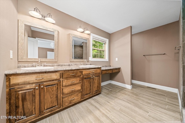 2689 Spruce Loop, Crossville, TN 38555 - full bathroom featuring double vanity, wood finished floors, and baseboards