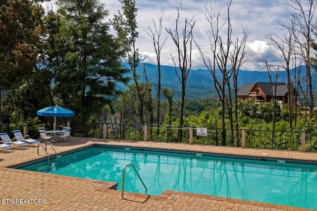 645 Wiley Oakley Dr, Gatlinburg, TN 37738 - community pool featuring a patio area and a mountain view