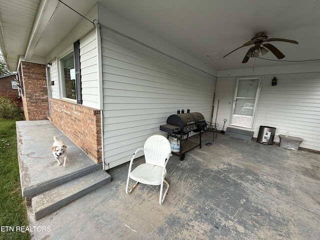 view of patio with ceiling fan and a grill