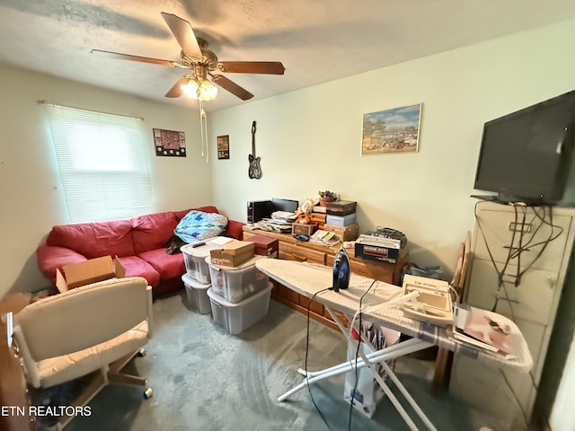 living area featuring ceiling fan