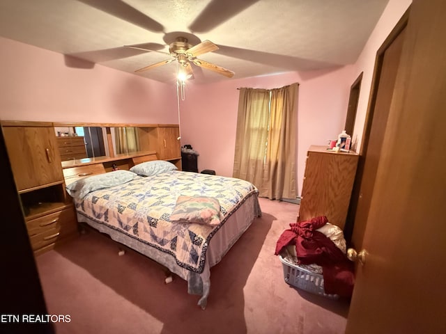 carpeted bedroom with a ceiling fan