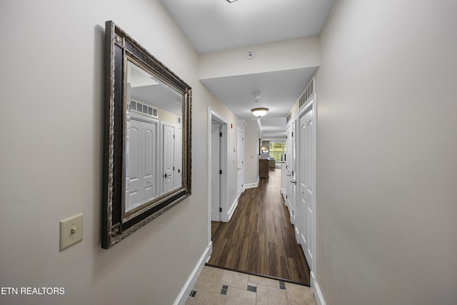 corridor featuring baseboards