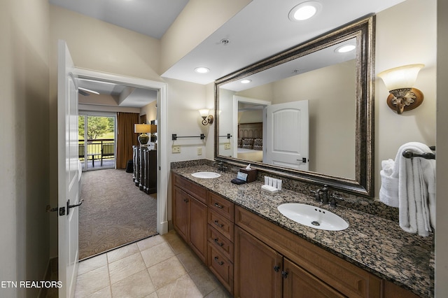 bathroom featuring double vanity, tile patterned flooring, and recessed lighting