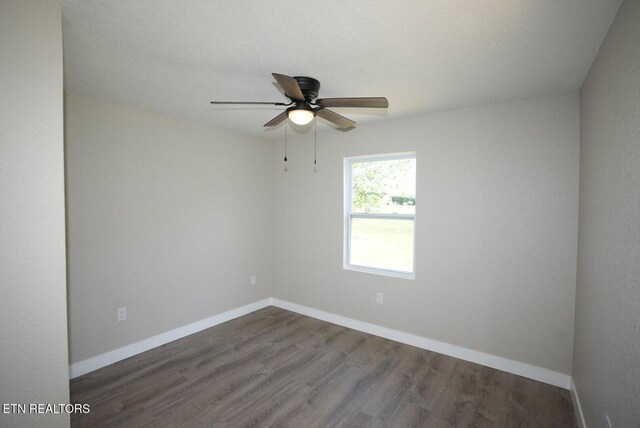 1712 Old Oak Grove Rd, Dandridge, TN 37725 - unfurnished room featuring ceiling fan, dark wood-style flooring, and baseboards