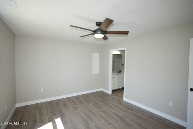 1712 Old Oak Grove Rd, Dandridge, TN 37725 - spare room featuring ceiling fan, wood finished floors, and baseboards