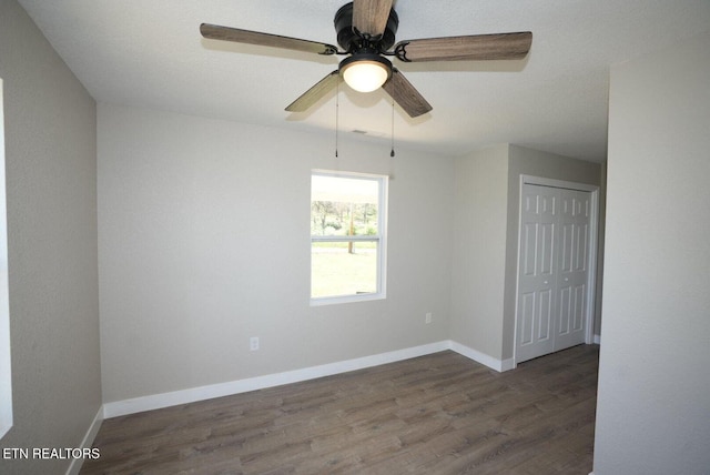 1712 Old Oak Grove Rd, Dandridge, TN 37725 - spare room featuring wood finished floors, ceiling fan, and baseboards
