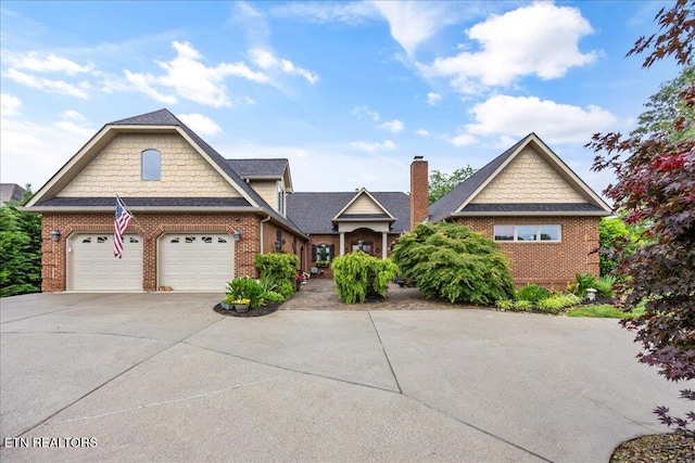 200 Bluffton Rd, Friendsville, TN 37737 - view of front of property featuring brick siding, concrete driveway, and a chimney