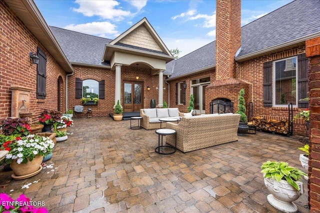 200 Bluffton Rd, Friendsville, TN 37737 - view of patio / terrace featuring french doors and an outdoor living space with a fireplace