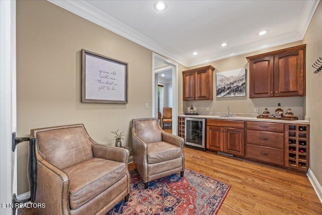 200 Bluffton Rd, Friendsville, TN 37737 - indoor wet bar with beverage cooler, ornamental molding, light wood-style floors, and recessed lighting