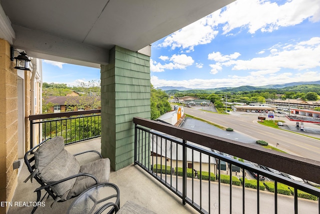balcony featuring a mountain view