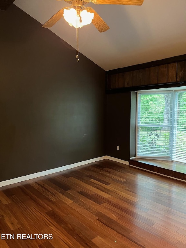 180 Cedar Ln, Jacksboro, TN 37757 - spare room with lofted ceiling, ceiling fan, dark wood finished floors, and baseboards