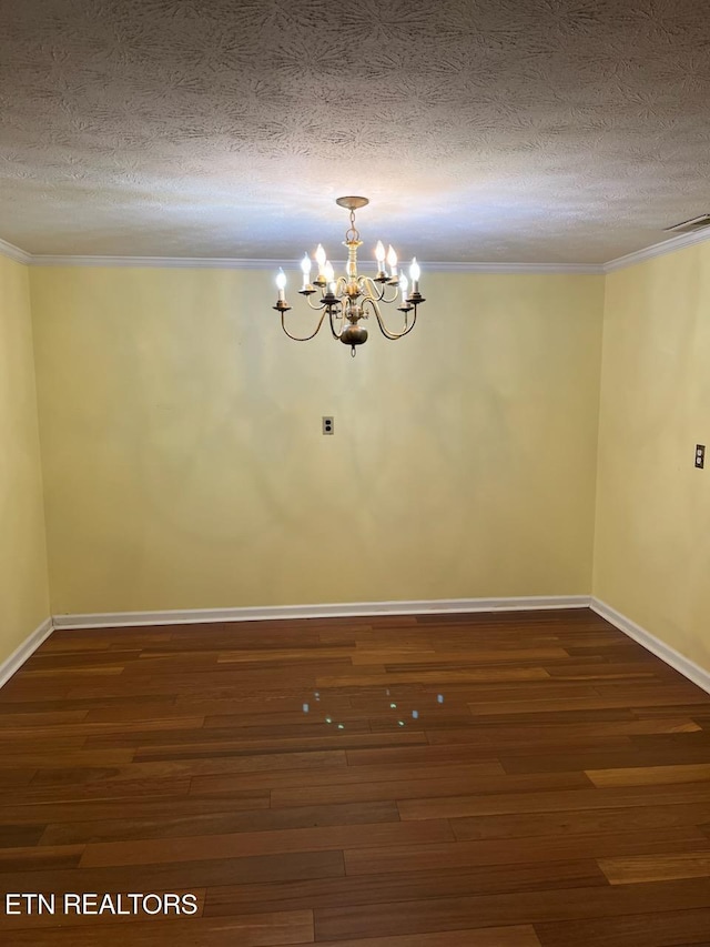 180 Cedar Ln, Jacksboro, TN 37757 - empty room featuring a chandelier, crown molding, a textured ceiling, dark wood-type flooring, and baseboards