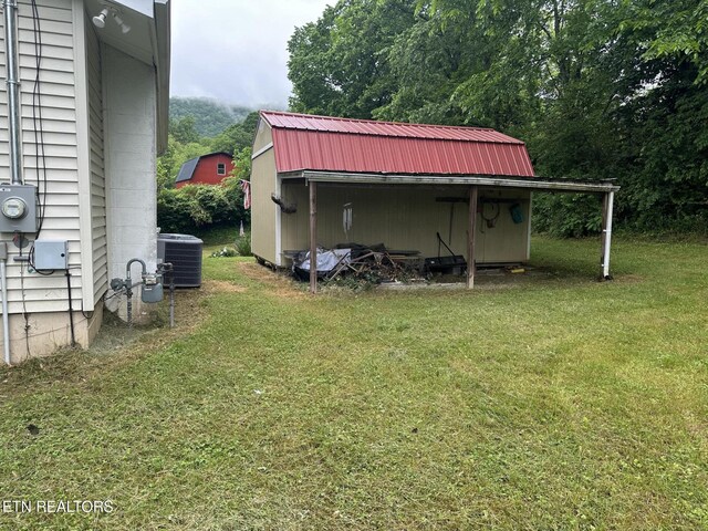 180 Cedar Ln, Jacksboro, TN 37757 - view of outbuilding featuring central AC and an outdoor structure