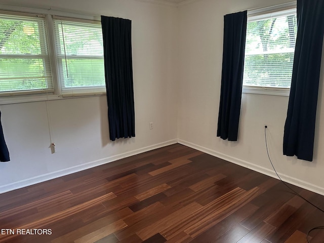 180 Cedar Ln, Jacksboro, TN 37757 - spare room featuring dark wood finished floors and baseboards