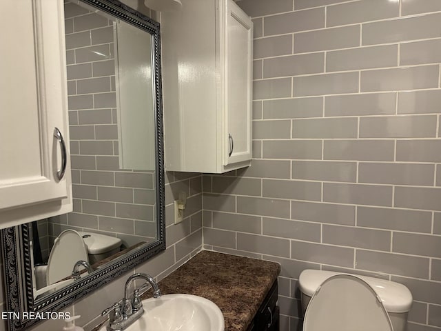 180 Cedar Ln, Jacksboro, TN 37757 - half bathroom with toilet, a sink, and decorative backsplash