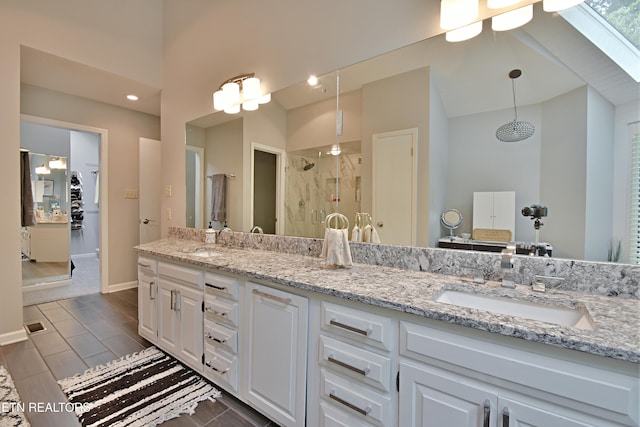 12212 Oakmont Cir, Knoxville, TN 37934 - full bathroom with a shower stall, double vanity, and lofted ceiling