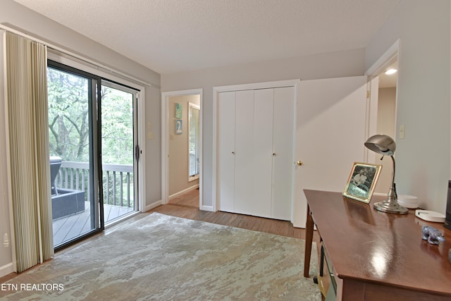12212 Oakmont Cir, Knoxville, TN 37934 - office featuring wood finished floors, baseboards, and a textured ceiling