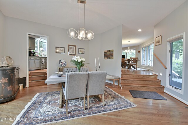 12212 Oakmont Cir, Knoxville, TN 37934 - dining space featuring a chandelier, wood finished floors, recessed lighting, baseboards, and stairway
