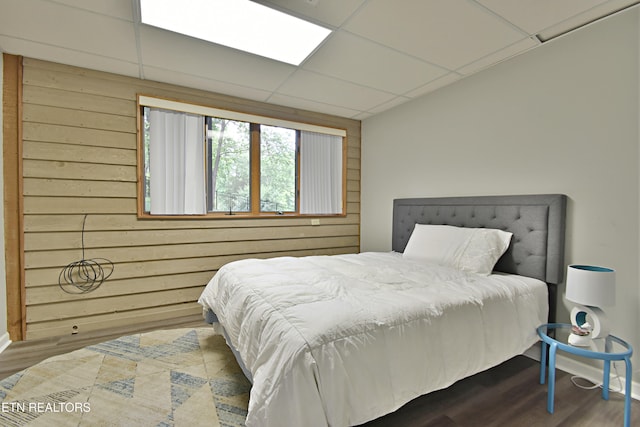 12212 Oakmont Cir, Knoxville, TN 37934 - bedroom featuring wood finished floors, wood walls, baseboards, and a paneled ceiling