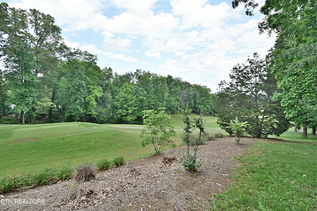 12212 Oakmont Cir, Knoxville, TN 37934 - surrounding community with a lawn, golf course view, and view of wooded area