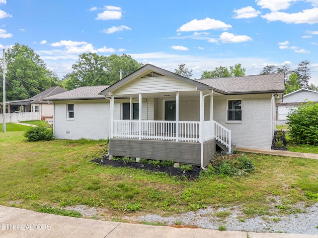9505 Pearson Rd, Harrison, TN 37341 - ranch-style house with covered porch, brick siding, a front lawn, and roof with shingles