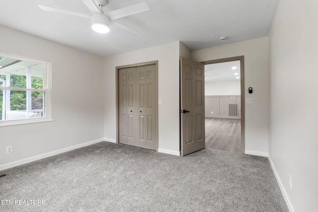 9505 Pearson Rd, Harrison, TN 37341 - unfurnished bedroom featuring carpet floors, a closet, baseboards, and a ceiling fan