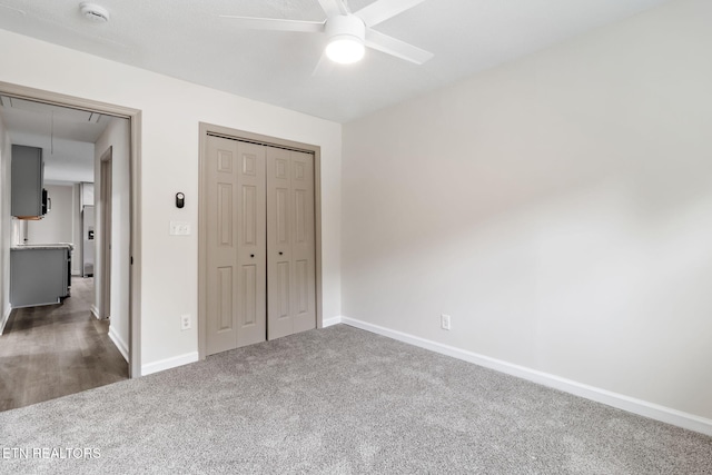 9505 Pearson Rd, Harrison, TN 37341 - unfurnished bedroom with dark colored carpet, baseboards, attic access, a closet, and a ceiling fan