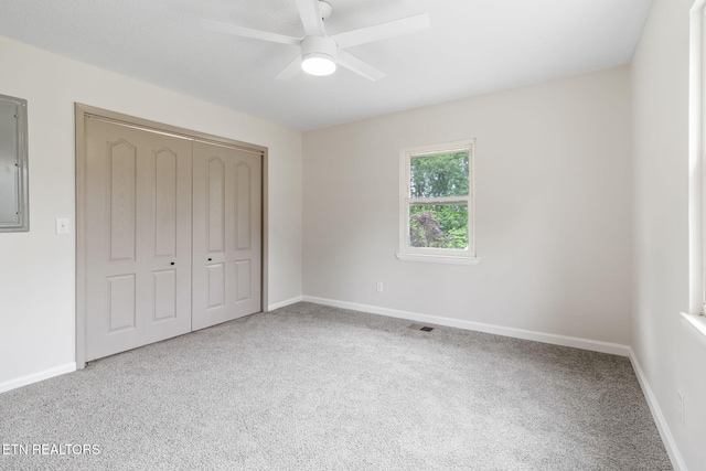 9505 Pearson Rd, Harrison, TN 37341 - unfurnished bedroom featuring carpet flooring, a closet, baseboards, and ceiling fan