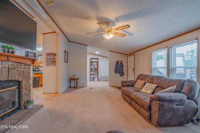 384 Lancer Rd, Harriman, TN 37748 - living area with ornamental molding, ceiling fan, light carpet, a fireplace, and a textured ceiling