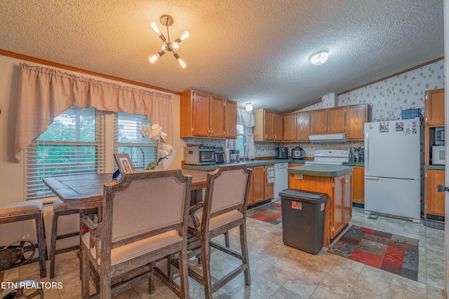 384 Lancer Rd, Harriman, TN 37748 - kitchen featuring white appliances, ornamental molding, under cabinet range hood, a textured ceiling, and a chandelier